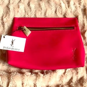 Hot pink YSL makeup bag